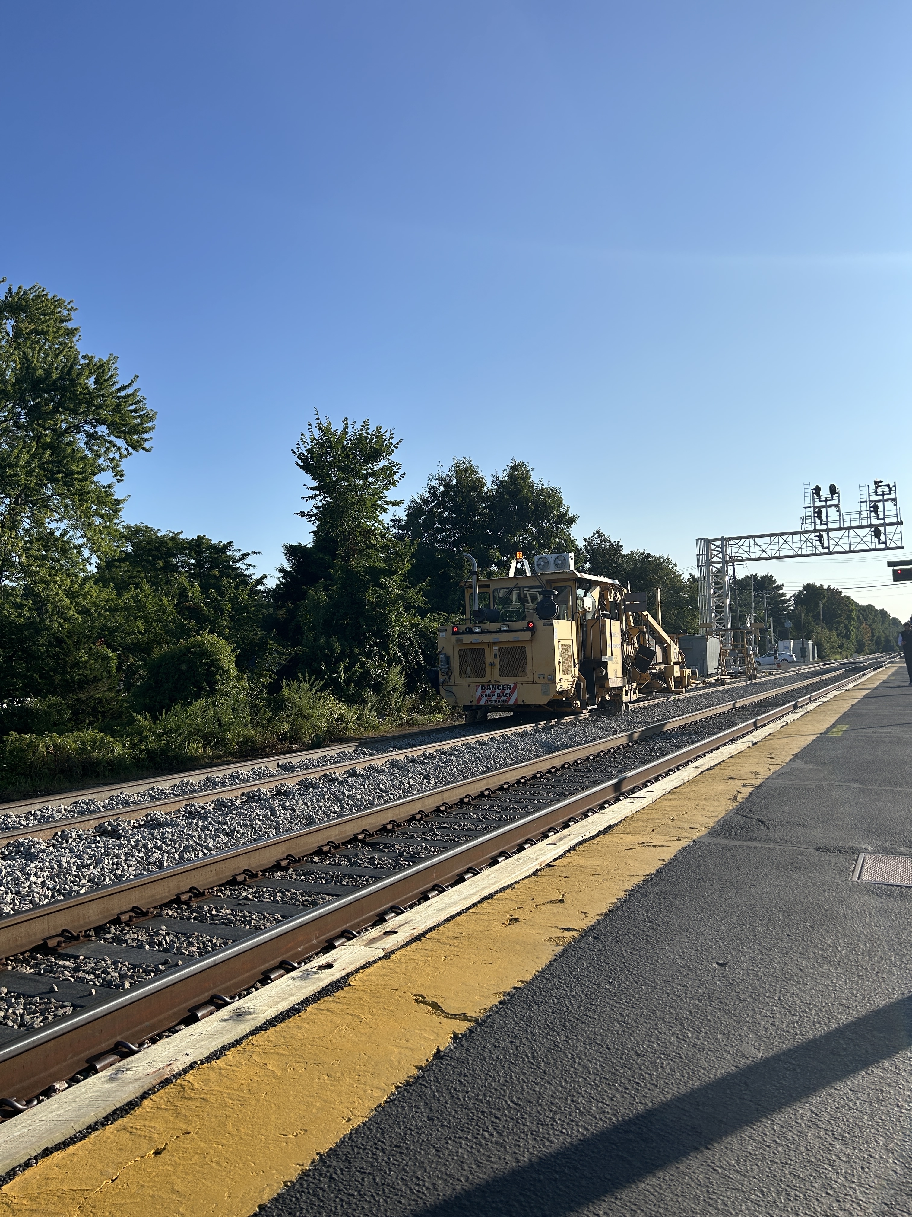 A blue sky above the train tracks