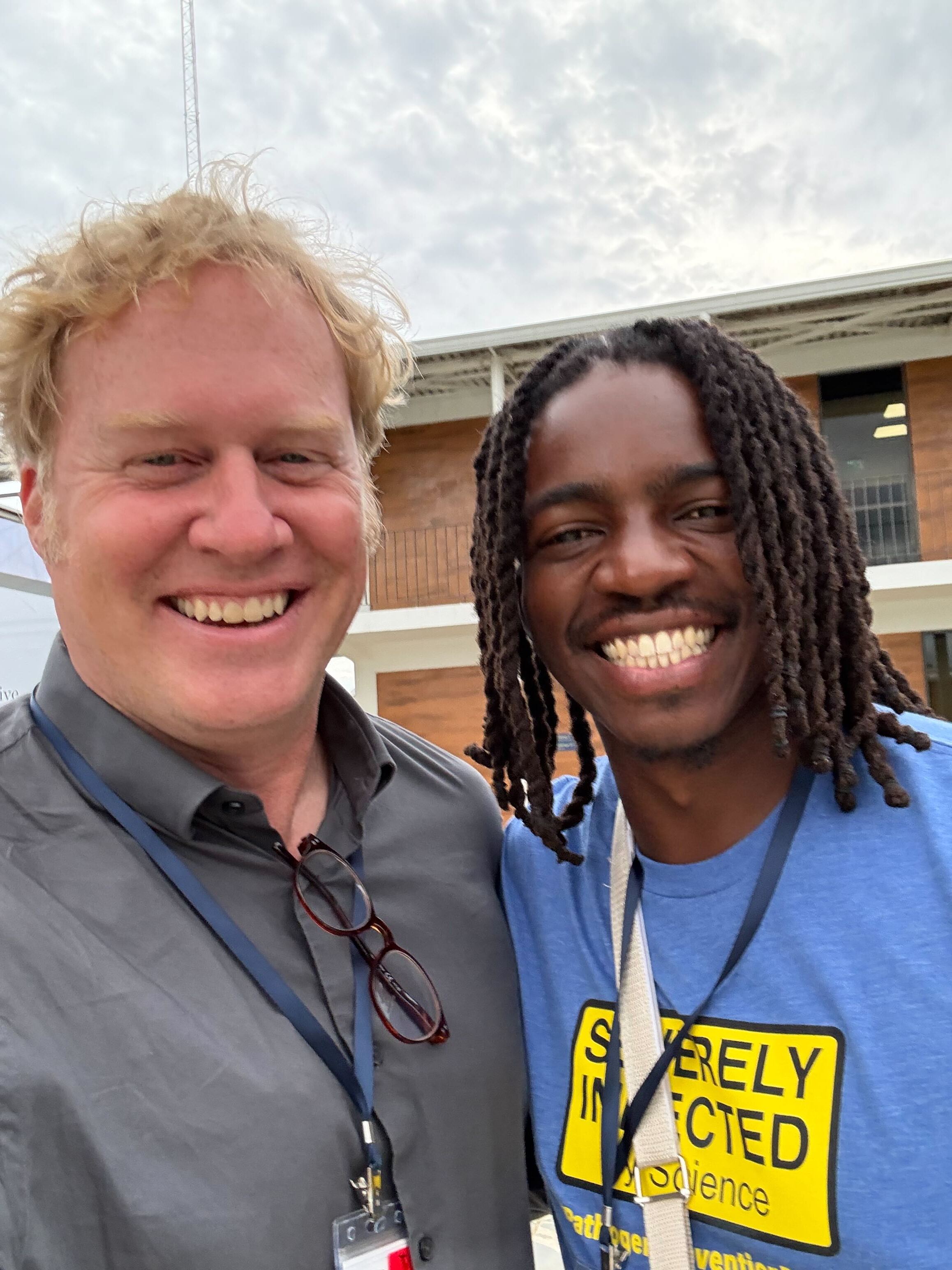 Two men, Ben and Iguosadolo, smile for the camera at Redeemer’s University in Nigeria.