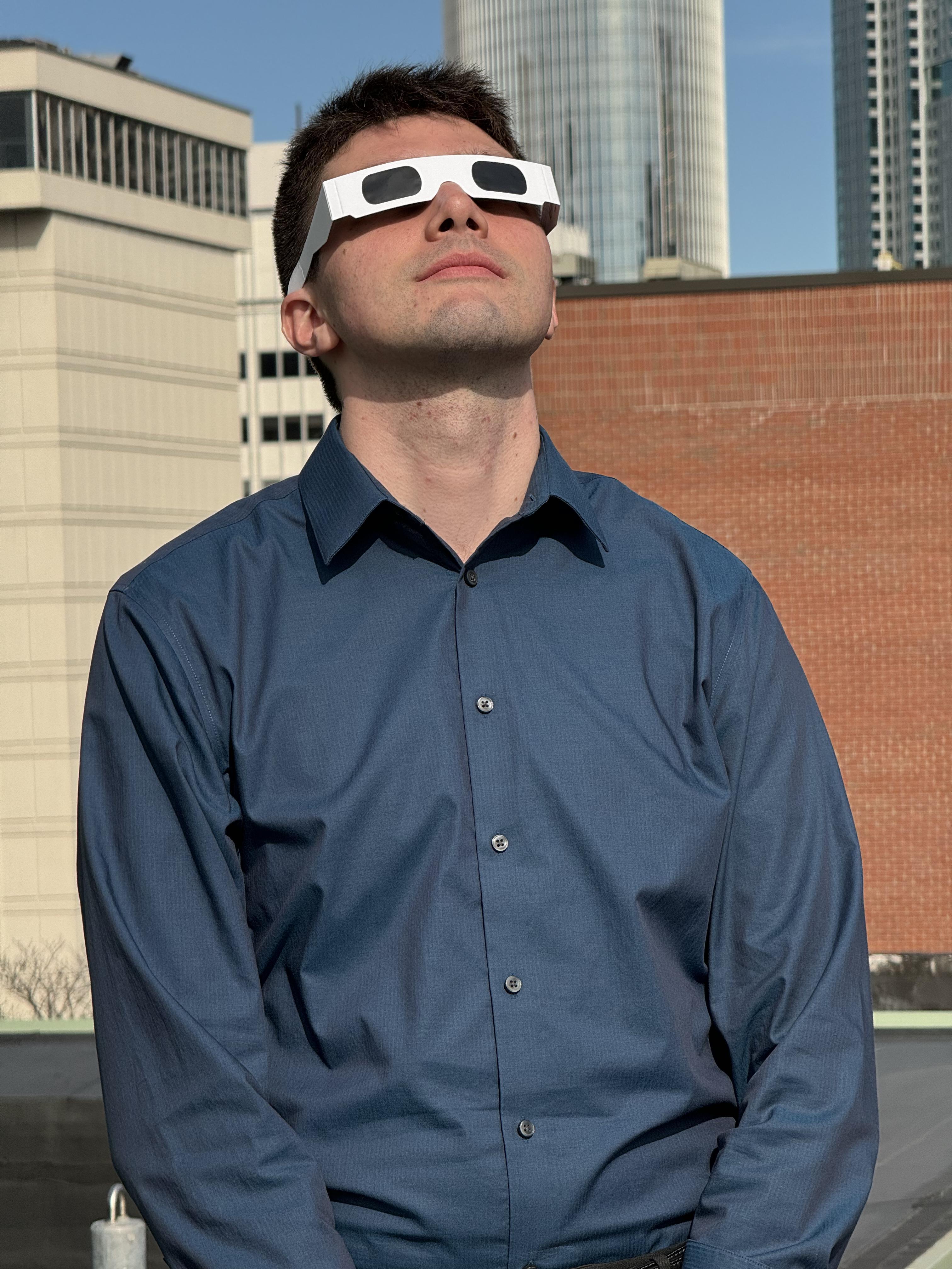 Paul watches the 2024 total eclipse with proper safety glasses.